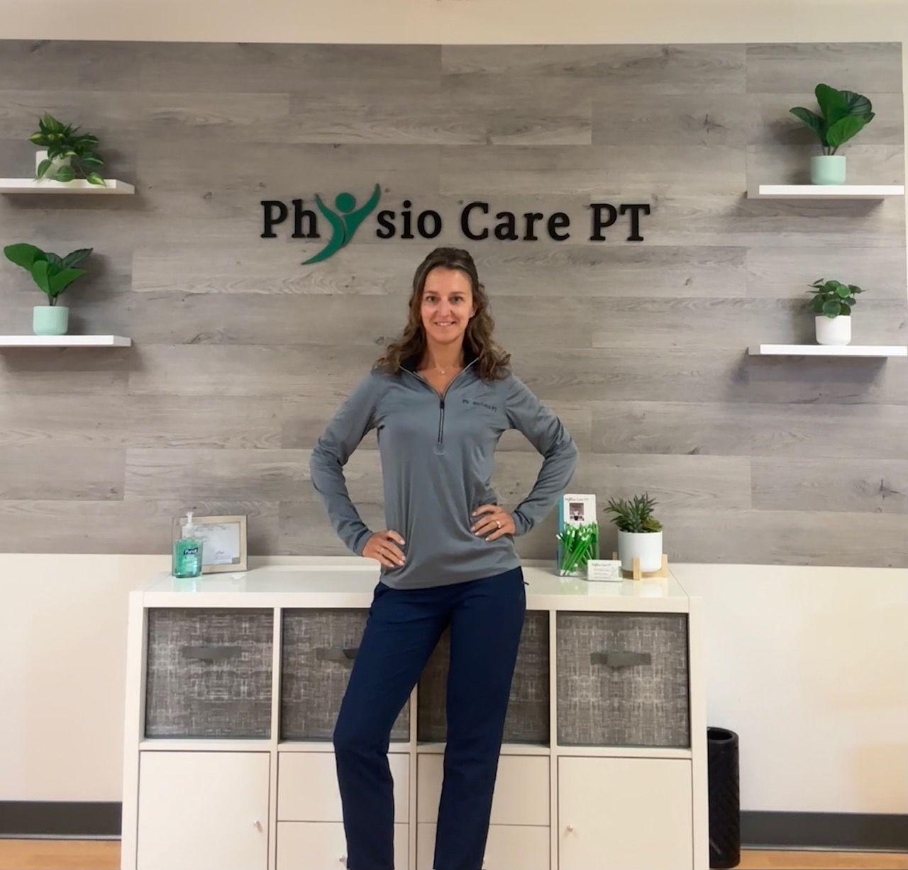 Person standing in front of a sign for Physio Care PT with plants and decor on shelves.